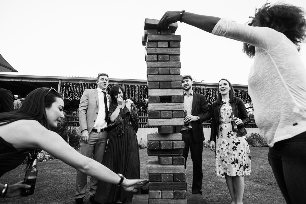 Wedding guests at Cradle Valley Guest house enjoying a game of giant jenga during canapes.
