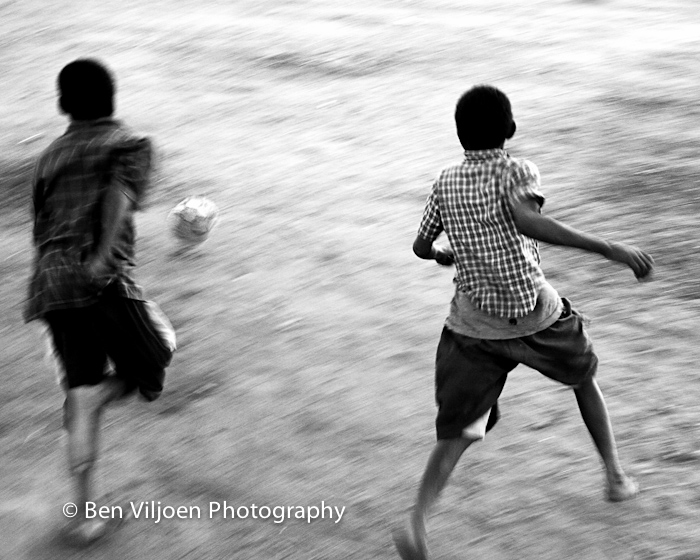 Rural African boys playing soccer